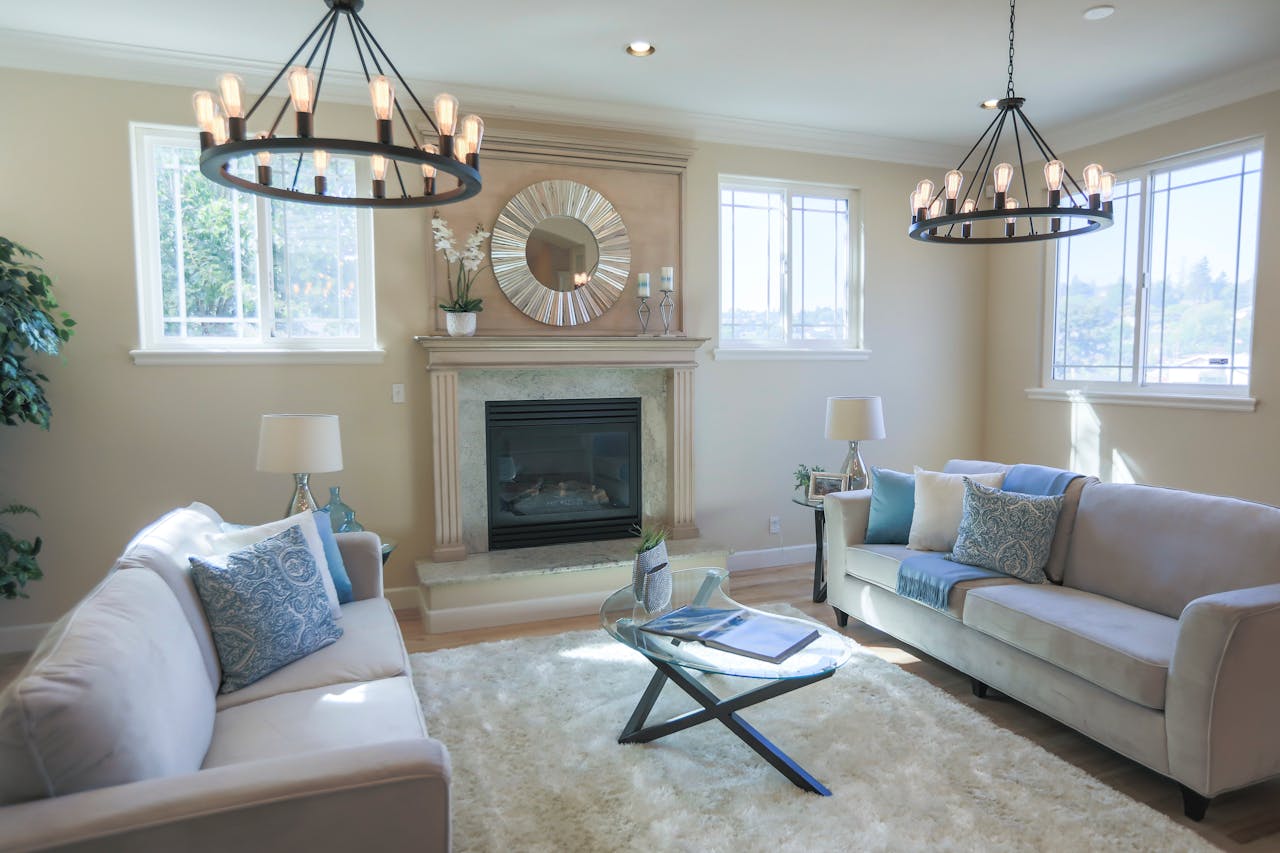 Contemporary living room featuring a fireplace, sofas, and modern decor.